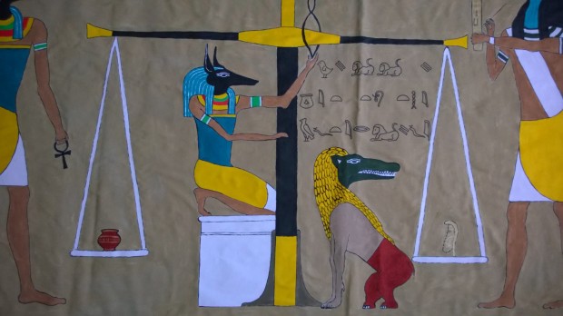 Anubis and Ammut weighing the heart.